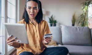 woman shocked by bank scammer and needing help from local bank in Granger